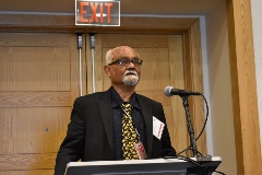 person presenting at a podium