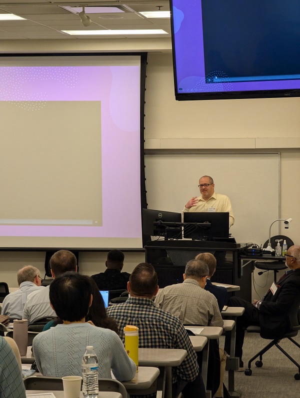 person presenting in an auditorium