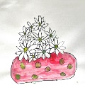 a grouping of flowers within a red polka dot vase