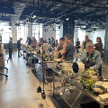 group of people cooking during the food as medicine series at the create culinary studio at the cincinnati museum center