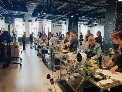 a group of people at a teaching kitchen event at the cincinnati museum center