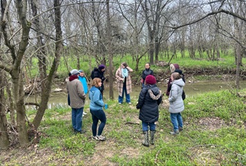 group of people in winter gear preparing for a winter forest therapy hike
