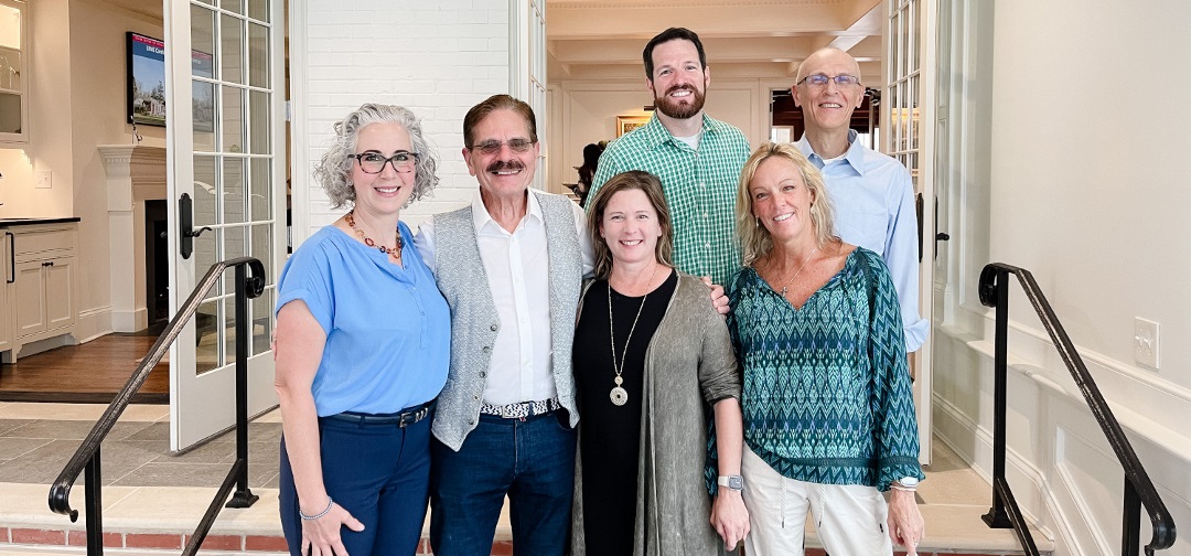 group of faculty leaders posing together at the faculty retreat