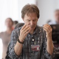 Man with hand in front of his face