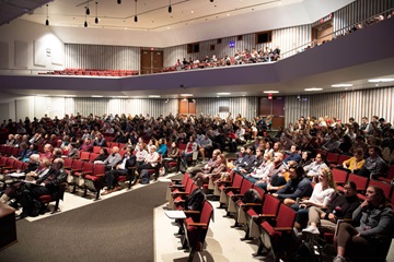 students sitting in an auditorium