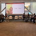 gloria yeh speaks to a group of people on her story