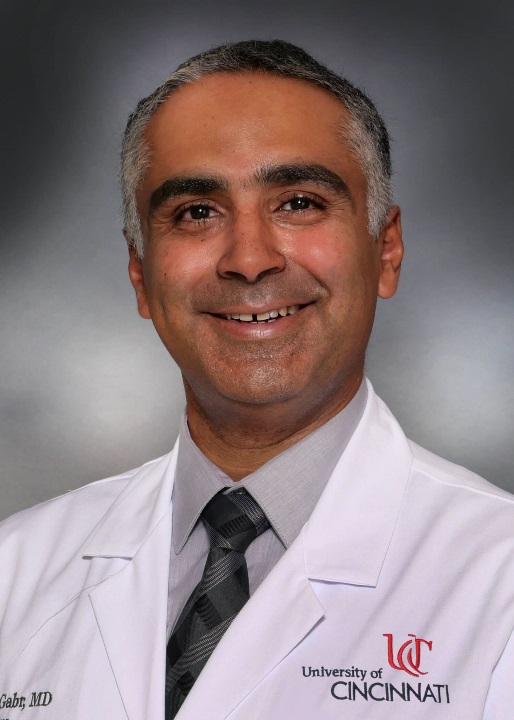 Gabr Moamen with UC lab coat