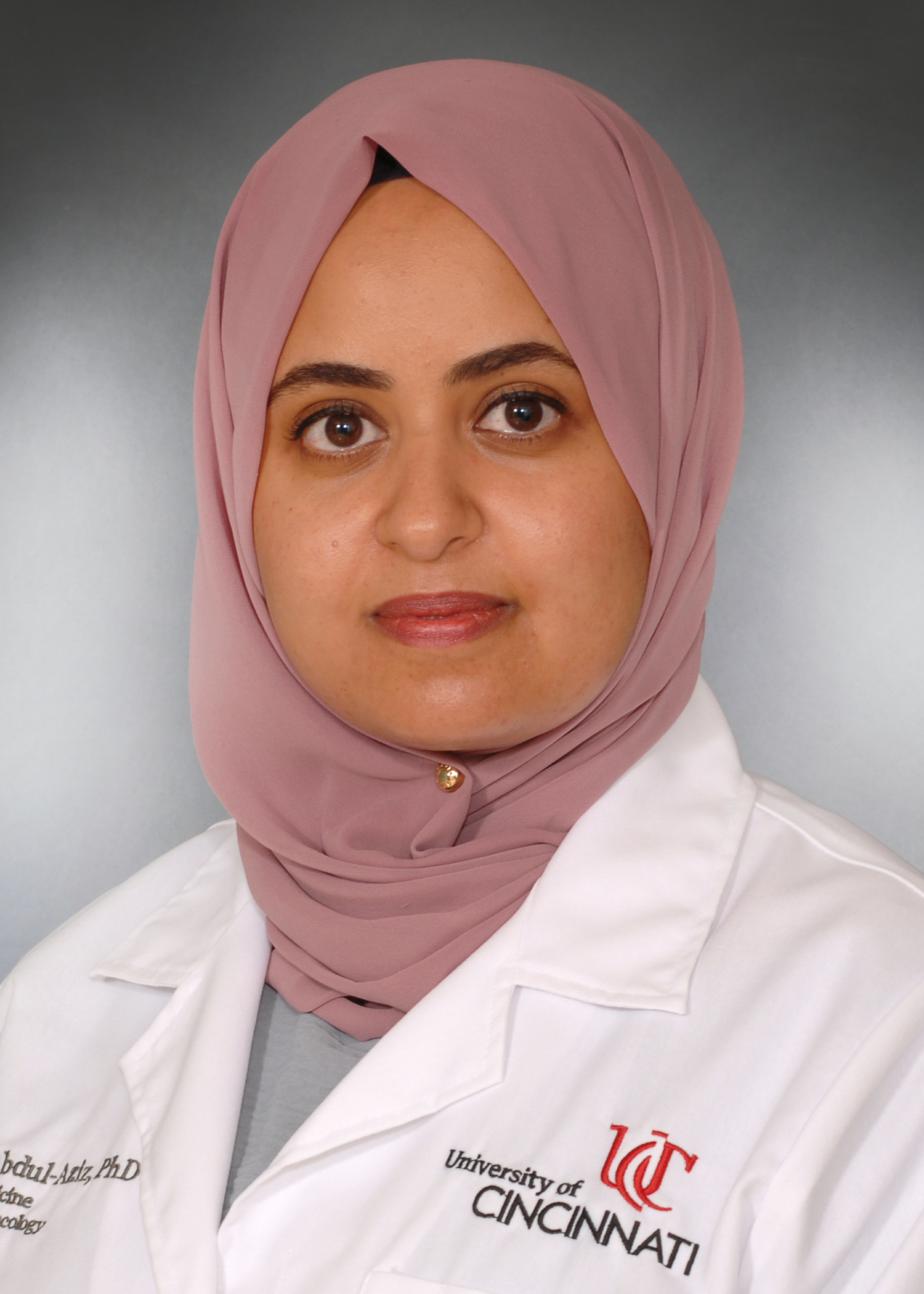 Abdul-Aziz Amina with UC lab coat