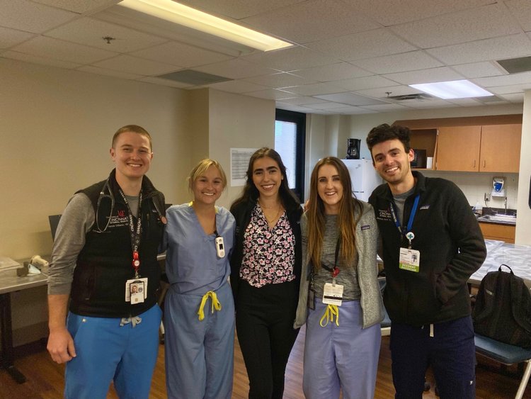 Photo of residents standing in nursing station