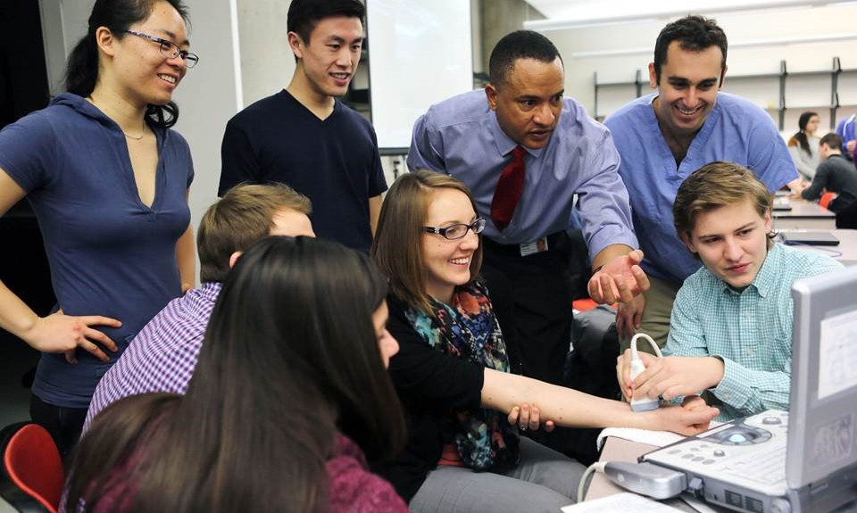 Group in front of computer teaching