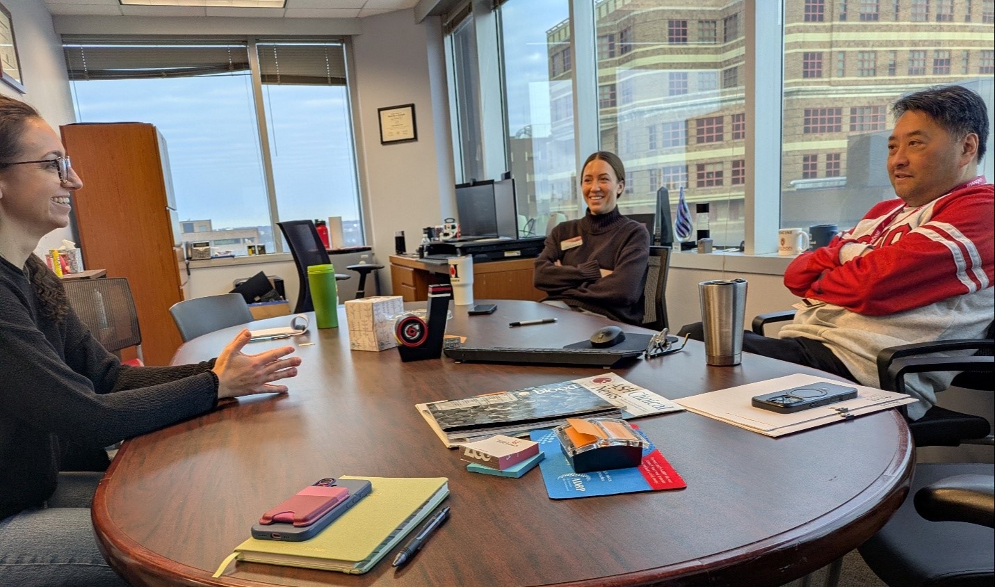 People sitting around an office table