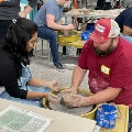 Two people making pottery