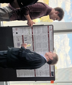 photo of Anthony and Andy at poster