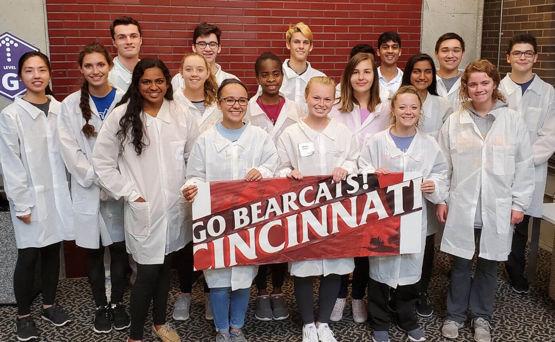 Future Med Students holding banner